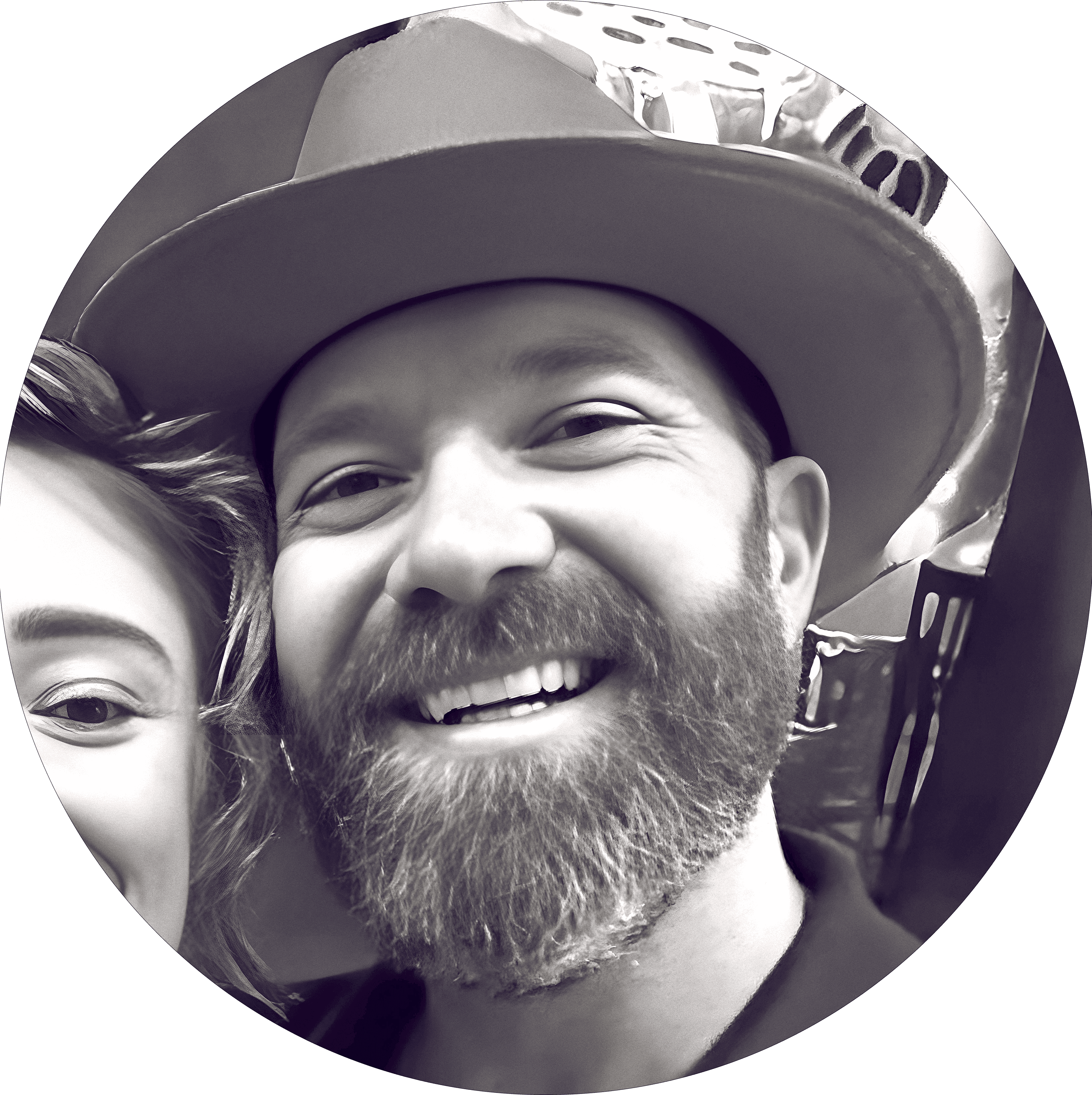 Close black-and-white photo of Shawn Christopher smiling beside a companion.
